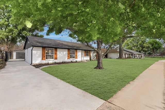 7319 Rutgers Dr, Dallas, TX 75214 - single story home featuring a gate, driveway, a front yard, brick siding, and a shingled roof