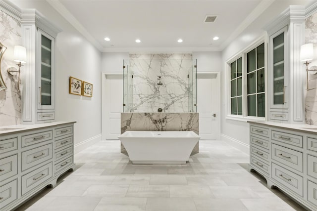 bathroom with baseboards, a marble finish shower, recessed lighting, vanity, and a freestanding bath