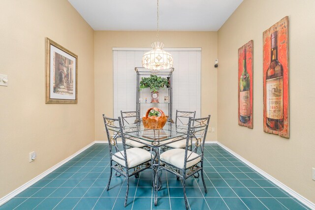 5509 Allen Ln, Rowlett, TX 75088 - dining area featuring dark tile patterned floors and baseboards