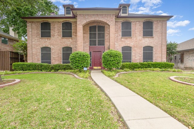 5509 Allen Ln, Rowlett, TX 75088 - view of front facade with brick siding and a front yard