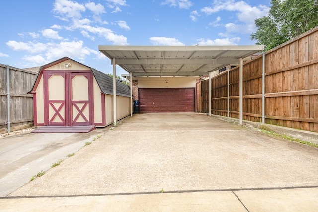 5509 Allen Ln, Rowlett, TX 75088 - view of shed with fence, a carport, and concrete driveway