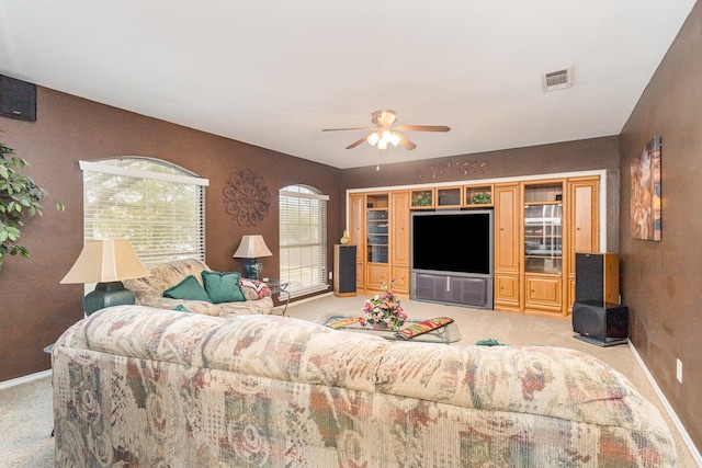 5509 Allen Ln, Rowlett, TX 75088 - living area featuring light colored carpet, baseboards, and ceiling fan