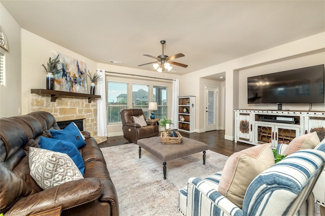 1519 Eminence Ln, Saint Paul, TX 75098 - living room featuring a stone fireplace, ceiling fan, wood finished floors, and baseboards