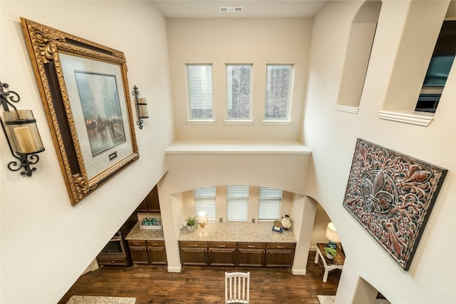 1519 Eminence Ln, Saint Paul, TX 75098 - foyer entrance featuring arched walkways and dark wood-style flooring