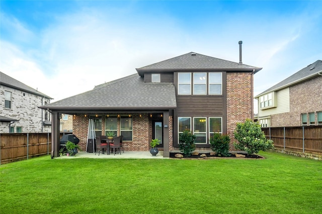 1519 Eminence Ln, Saint Paul, TX 75098 - back of house with brick siding, a patio area, and a shingled roof