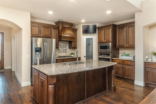 1519 Eminence Ln, Saint Paul, TX 75098 - kitchen featuring appliances with stainless steel finishes, custom exhaust hood, light stone countertops, dark wood-type flooring, and recessed lighting