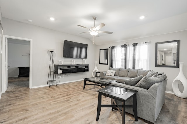 living room featuring ceiling fan, wood finished floors, baseboards, recessed lighting, and vaulted ceiling