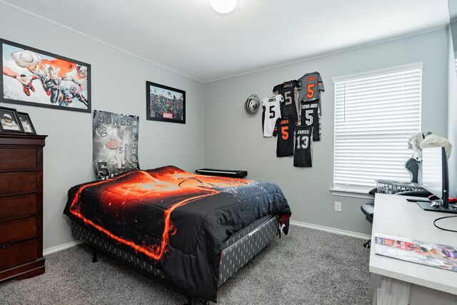 bedroom with carpet and baseboards