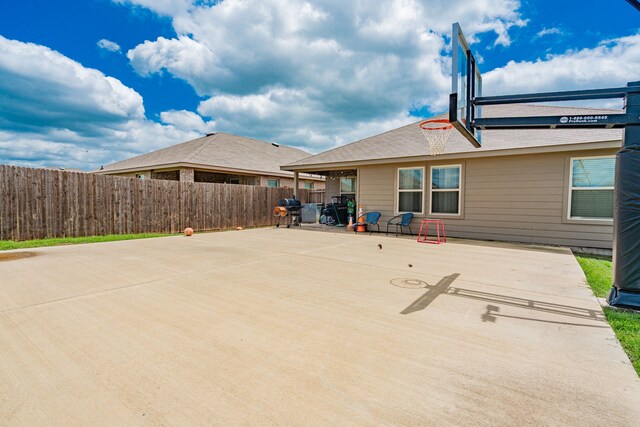 view of patio with fence and grilling area