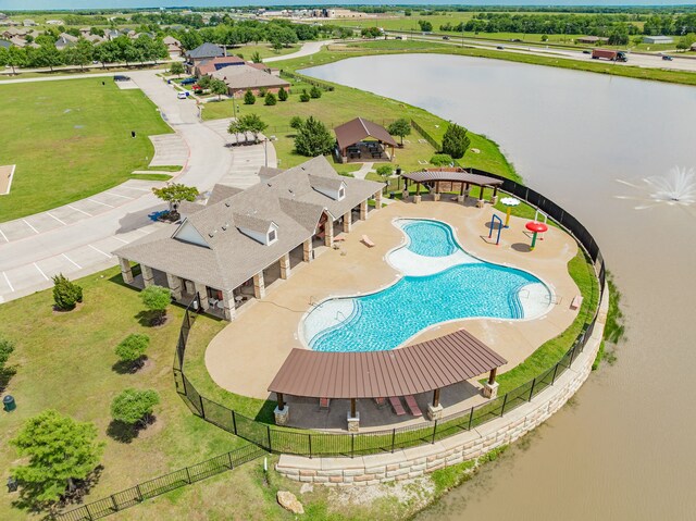 bird's eye view of a nearby body of water and a pool