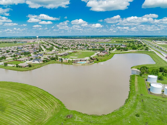 aerial view of residential area featuring a nearby body of water