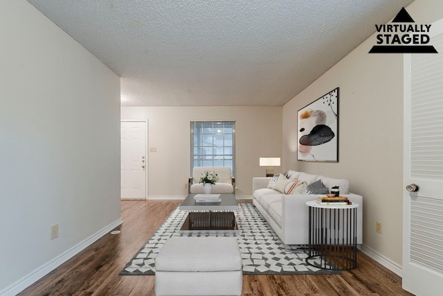 1600 Lagoona Ln, Edgecliff Village, TX 76134 - living room with wood finished floors, a textured ceiling, and baseboards