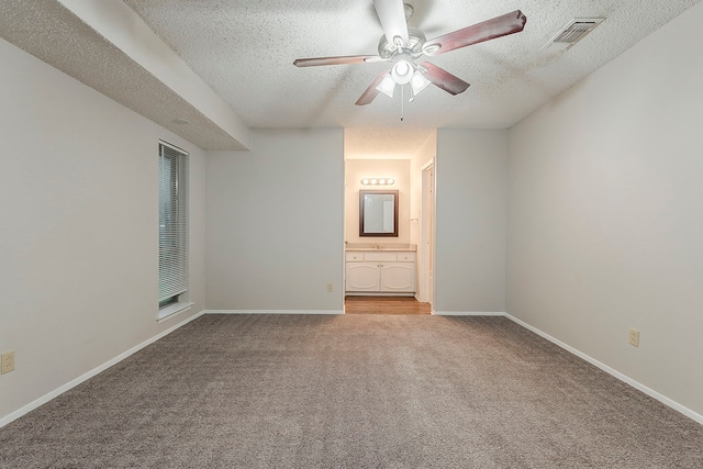 1600 Lagoona Ln, Edgecliff Village, TX 76134 - unfurnished room with a textured ceiling, light colored carpet, ceiling fan, and baseboards