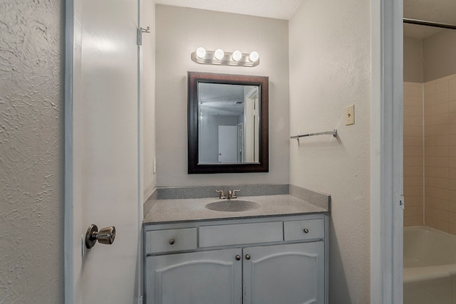 1600 Lagoona Ln, Edgecliff Village, TX 76134 - full bath featuring vanity, shower / washtub combination, and a textured wall