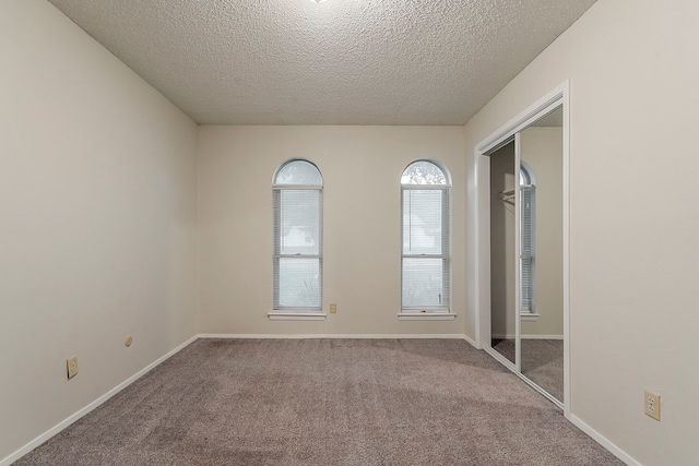1600 Lagoona Ln, Edgecliff Village, TX 76134 - carpeted spare room featuring a textured ceiling and baseboards