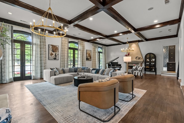 living area featuring a chandelier, french doors, wood finished floors, beam ceiling, and coffered ceiling