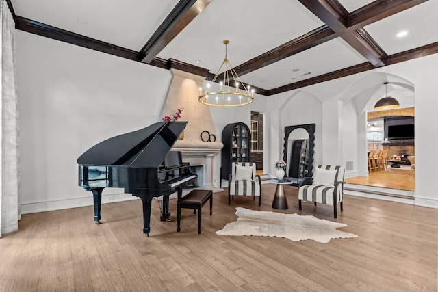 1100 La Paloma Ct, Southlake, TX 76092 - living area with arched walkways, a chandelier, beamed ceiling, wood finished floors, and coffered ceiling