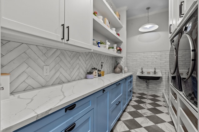1100 La Paloma Ct, Southlake, TX 76092 - kitchen featuring blue cabinetry, open shelves, crown molding, a sink, and pendant lighting