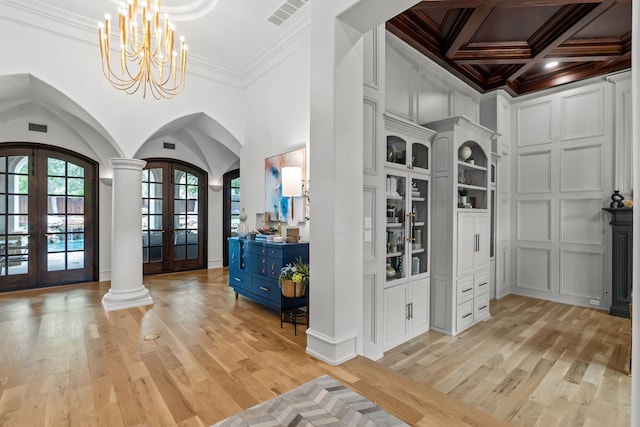 1100 La Paloma Ct, Southlake, TX 76092 - entryway featuring french doors, arched walkways, ornamental molding, light wood-style floors, and a chandelier
