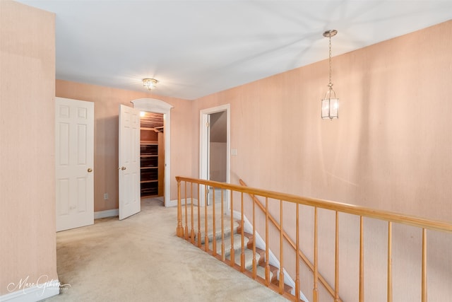 8705 W Wilderness Way, Shreveport, LA 71106 - hallway with an upstairs landing and carpet floors