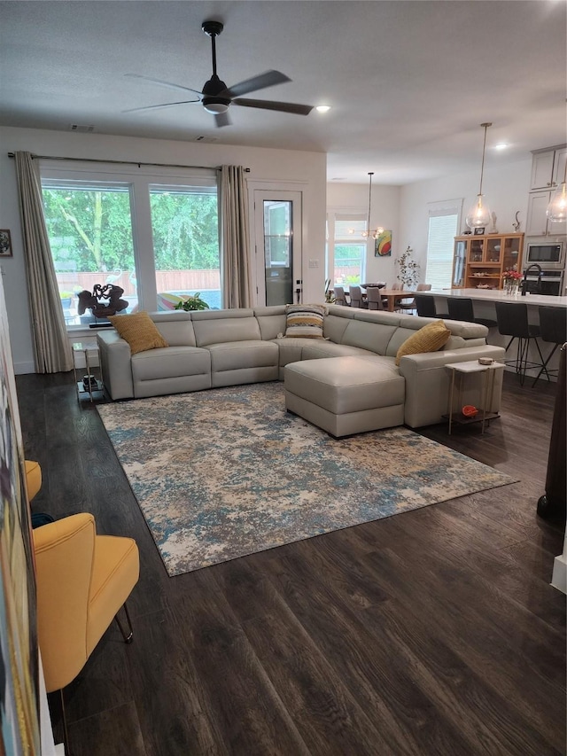living room featuring ceiling fan, wood finished floors, and recessed lighting