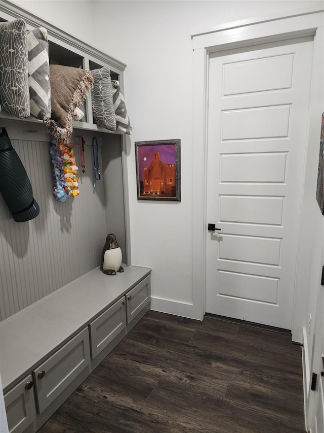 mudroom featuring dark wood-style floors and baseboards