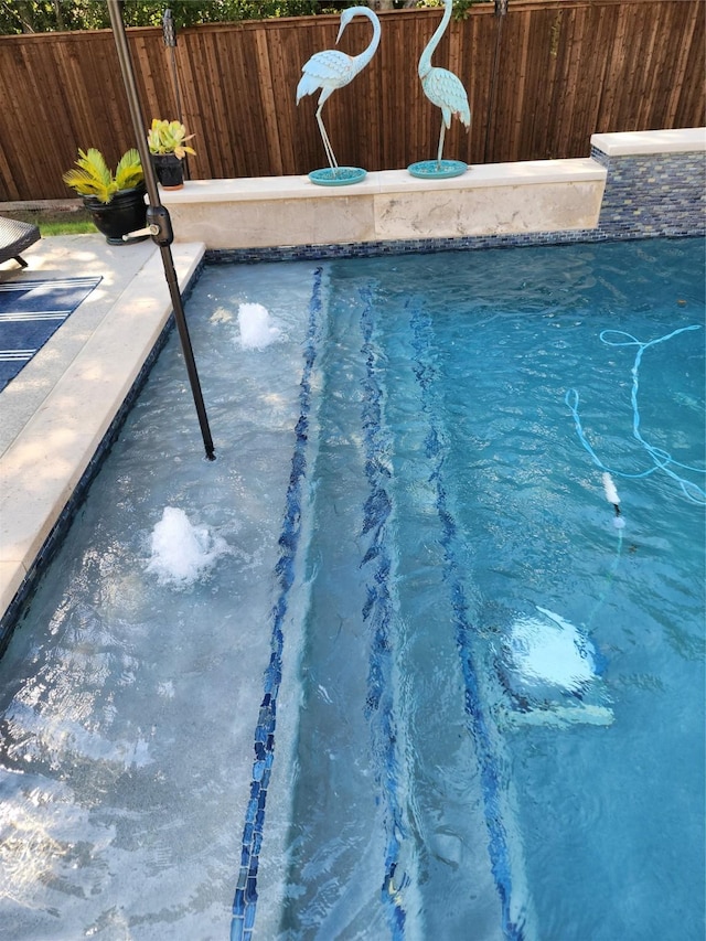 view of pool with fence