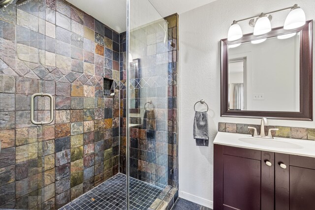 5533 Bonita Ave, Dallas, TX 75206 - bathroom with vanity, a stall shower, and a textured wall
