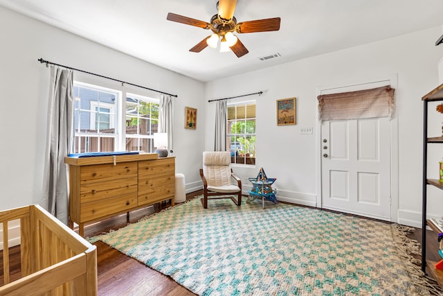 5533 Bonita Ave, Dallas, TX 75206 - bedroom with wood finished floors, a ceiling fan, and baseboards