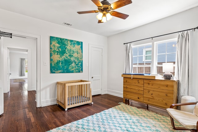 5533 Bonita Ave, Dallas, TX 75206 - bedroom featuring wood finished floors, baseboards, and a ceiling fan