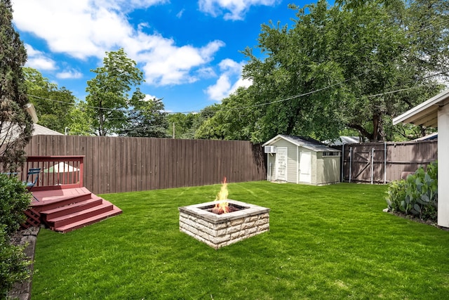 5533 Bonita Ave, Dallas, TX 75206 - view of yard featuring a storage unit, an outdoor fire pit, an outdoor structure, and a deck