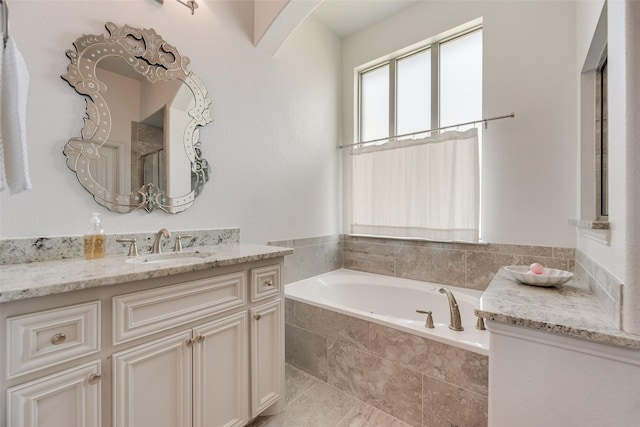 full bathroom featuring a bath, vanity, a shower with door, and tile patterned flooring