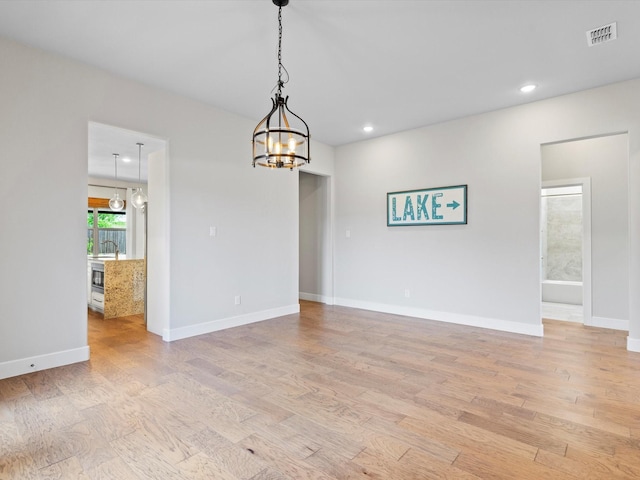 323 Green Meadow Dr, Little Elm, TX 75068 - unfurnished room with light wood-style flooring, a chandelier, baseboards, recessed lighting, and a sink