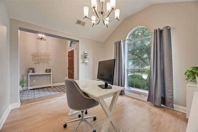 office space with vaulted ceiling, a chandelier, light wood-style flooring, and baseboards