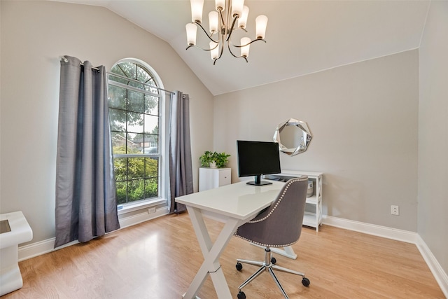 office featuring plenty of natural light, lofted ceiling, light wood-style flooring, and baseboards
