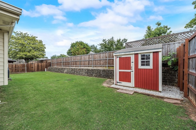 view of yard featuring a storage unit and an outbuilding