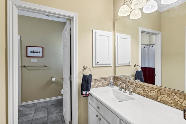 3568 Green Meadows Dr, Glen Rose, TX 76043 - bathroom with vanity, toilet, decorative backsplash, and baseboards