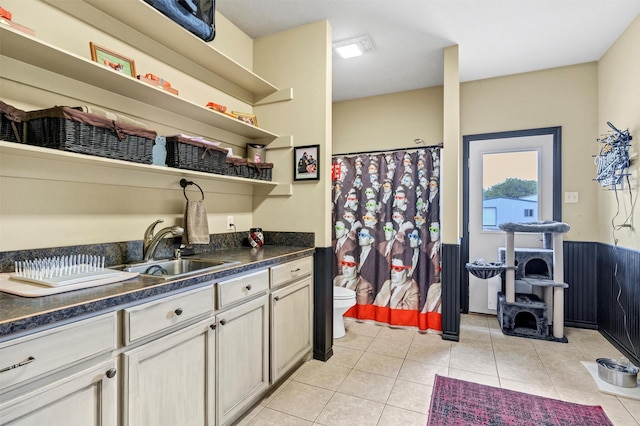 3568 Green Meadows Dr, Glen Rose, TX 76043 - kitchen with a sink, open shelves, dark countertops, and light tile patterned floors