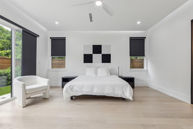 bedroom with recessed lighting, light wood-type flooring, ceiling fan, and baseboards