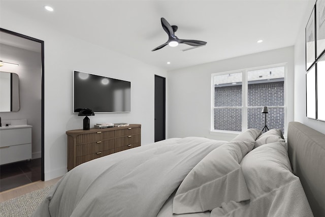 bedroom with wood finished floors, recessed lighting, ceiling fan, and baseboards