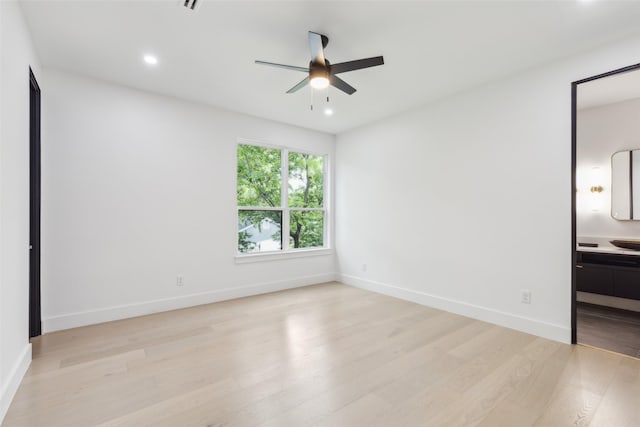 unfurnished bedroom with light wood-style floors, baseboards, ensuite bath, recessed lighting, and a ceiling fan