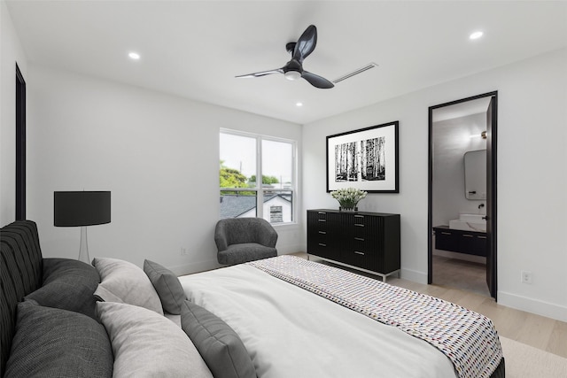 bedroom featuring light wood-type flooring, recessed lighting, baseboards, ceiling fan, and ensuite bathroom