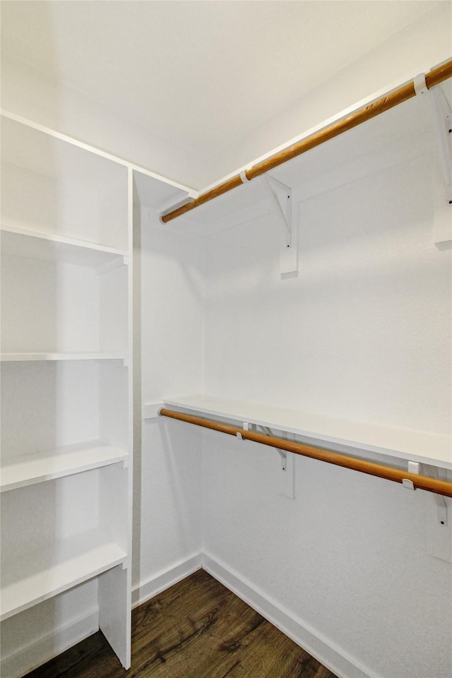 14590 Coffee Ln, Scurry, TX 75158 - walk in closet with dark wood finished floors
