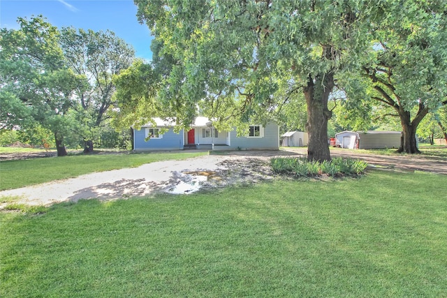 14590 Coffee Ln, Scurry, TX 75158 - view of front of property featuring a front lawn and driveway