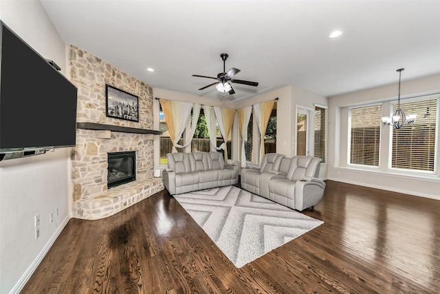 5112 Fringetree Dr, Mckinney, TX 75071 - living area featuring a fireplace, a chandelier, baseboards, ceiling fan, and wood finished floors