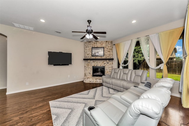 5112 Fringetree Dr, Mckinney, TX 75071 - living room with ceiling fan, baseboards, a stone fireplace, dark wood-type flooring, and recessed lighting