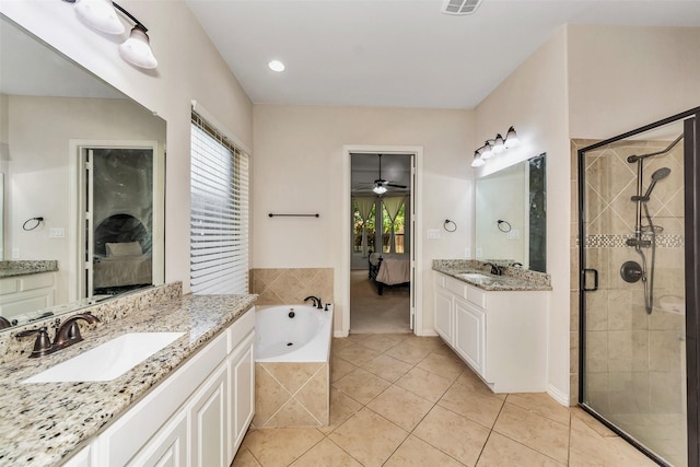 5112 Fringetree Dr, Mckinney, TX 75071 - bathroom with ensuite bath, a shower stall, a ceiling fan, a garden tub, and tile patterned floors