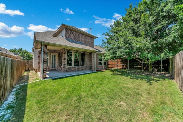 5112 Fringetree Dr, Mckinney, TX 75071 - rear view of house with brick siding, roof with shingles, and a patio area