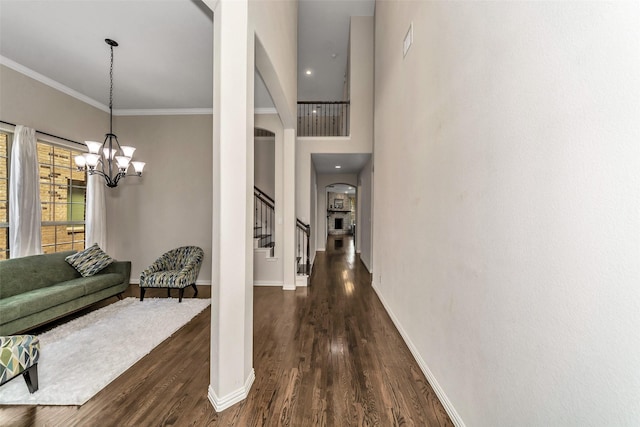5112 Fringetree Dr, Mckinney, TX 75071 - interior space with dark wood finished floors, ornamental molding, baseboards, stairway, and arched walkways