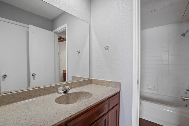 6708 S Creek Dr, Fort Worth, TX 76133 - bathroom with vanity, shower / bathtub combination, and a textured wall